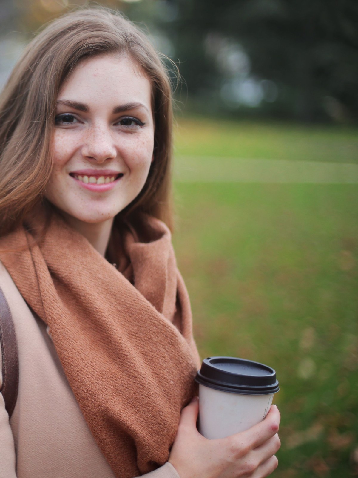 A person using their phone at home in warm natural light